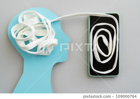 Online therapy concept - tangled white lace gets untangled via phone 109000764