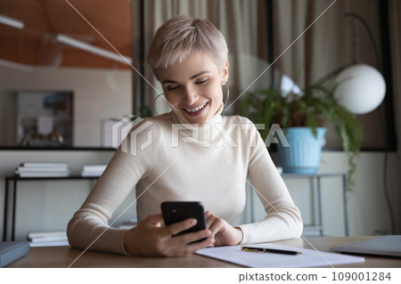 Happy businesswoman, office employee using app, service mobile phone Happy businesswoman, office employee using app, service mobile phone 109001284