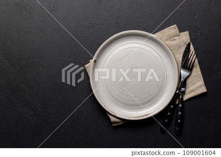 Mockup for a delicious meal. Empty plate on a table Mockup for a delicious meal. Empty plate on a table 109001604