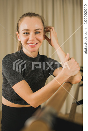 Portrait Active young woman portrait female ballet or contemporary dance teacher class in studio Portrait Active young woman portrait female ballet or contemporary dance teacher class in studio 109002040