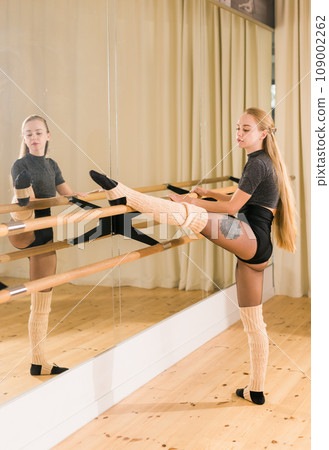 Ballerina in pointe pose. Beautiful ballet dancer stretching in class. Ballerina woman training Ballerina in pointe pose. Beautiful ballet dancer stretching in class. Ballerina woman training 109002262