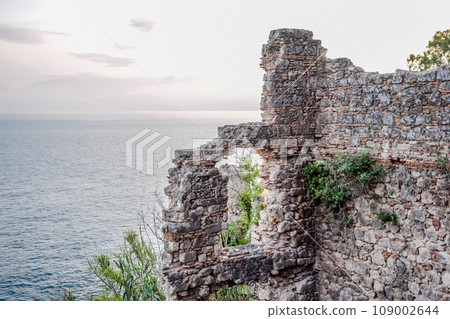 Ruins of ancient buildings on coast of Antalya. Ancient buildings by the sea. 109002644