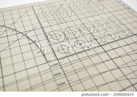 closeup grey cutting mat, equipment in office closeup grey cutting mat, equipment in office 109006924