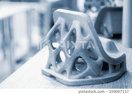 Abstract detail model printed on 3D printer from polyamide powder using the technology Multi Jet Fusion, MJF. Three-dimensional volumetric model created on 3D printer from powder plastic close-up. 109007137