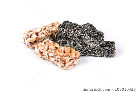A set of different gozinaki dessert bars isolated on white background A set of different gozinaki dessert bars isolated on white background 109010428