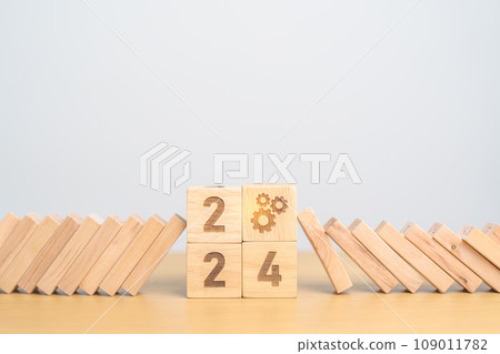 2024 year and falling blocks with Gear icon. Team, teamwork, Goal, mission, strategy, plan, Action, partnership, Risk Management, recession, goal, New Year planning and inflation economy 2024 year and falling blocks with Gear icon. Team, teamwork, Goal, mission, strategy, plan, Action, partnership, Risk Management, recession, goal, New Year planning and inflation economy 109011782