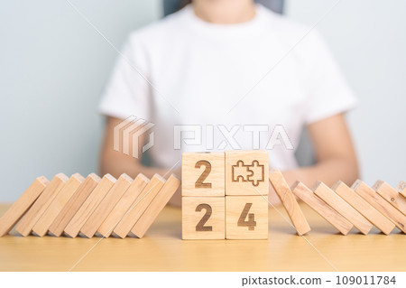 2024 year and falling blocks with jigsaw puzzle icon. Team, teamwork, Goal, mission, strategy, plan, Action, partnership, Risk Management, recession, goal, New Year planning and inflation economy 2024 year and falling blocks with jigsaw puzzle icon. Team, teamwork, Goal, mission, strategy, plan, Action, partnership, Risk Management, recession, goal, New Year planning and inflation economy 109011784