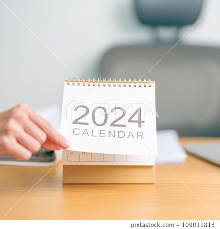 2024 Year Calendar on table background. countdown, Happy New Year, Resolution, Goals, Plan,  Action, Mission and financial Concept 109011813