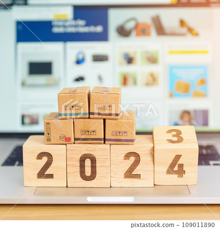 2024 New Year Online Shopping concept. Shipping Boxes on laptop computer. Sale and discount during Christmas and New Year holiday, ecommerce, shipping delivery, logistics and Cyber Monday 109011890