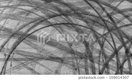 Aerial view tire track mark on asphalt tarmac road race track texture and background, Abstract background black tire track skid on asphalt road, Tire mark skid mark on asphalt road. Aerial view tire track mark on asphalt tarmac road race track texture and background, Abstract background black tire track skid on asphalt road, Tire mark skid mark on asphalt road. 109014307