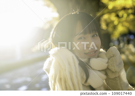 Young woman enjoying autumn leaves hunting Young woman enjoying autumn leaves hunting 109017440