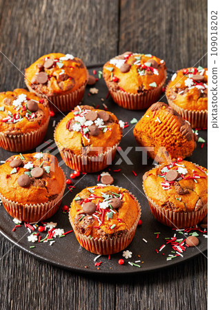 Christmas sweet potato muffin topped with holiday sprinkles Christmas sweet potato muffin topped with holiday sprinkles 109018202
