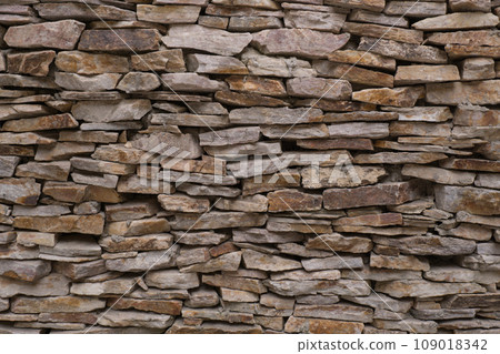 Old brown brick wall pattern. Stone background. Old brown brick wall pattern. Stone background. 109018342