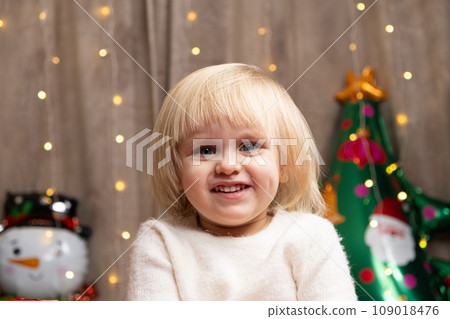 Portrait of two year old little Christmas blonde girl with blue eyes Portrait of two year old little Christmas blonde girl with blue eyes 109018476