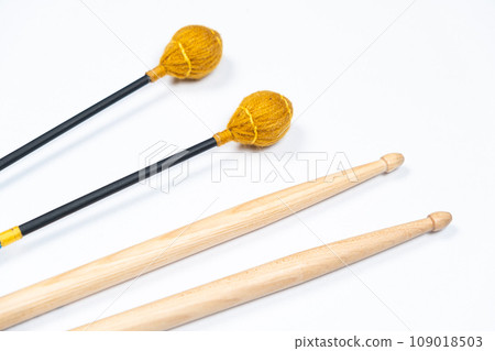 Xylophone and drum sticks on white background top view 109018503