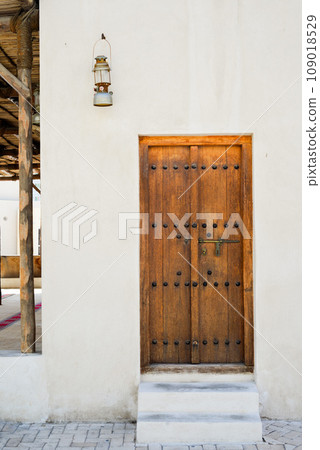 Arabic style carved wooden doors in Al Fahidi Historical District, Deira, Dubai, United Arab Emirates. 109018529