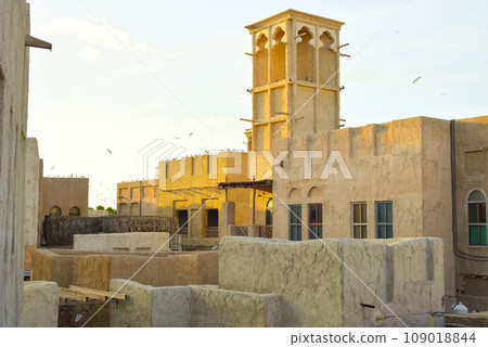 Dubai, UAE. Buildings and houses of traditional historical architecture of the old city of the Emirates in the Persian Gulf. The clay houses of Al Sifa. Deira, Burdubai. 109018844