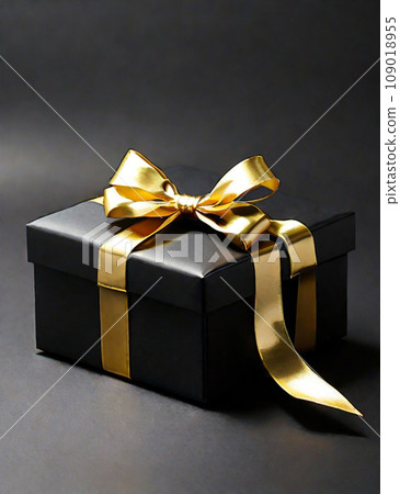 Black gift box with gold ribbon on blurred black background. Copy space. New Year. Birthday. Black Friday discount concept 109018955