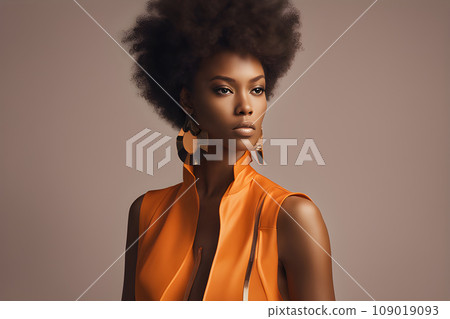 Beautiful African female model with curly hair wearing an orange jacket. Studio photography Beautiful African female model with curly hair wearing an orange jacket. Studio photography 109019093