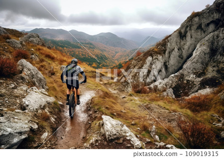 Mountain biker on a trail with autumn colors in a mountain. Generative AI 109019315