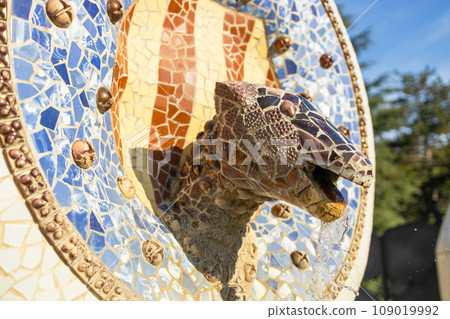 Gaudi Snake and four Catalan bars Mosaic lizard ceramic tile, decoration in Park Guell, Barcelona, Spain. 109019992