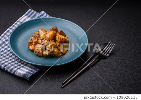 Delicious crispy fried potato wedges with salt, spices and herbs 109020115