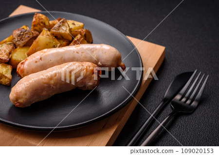 Delicious grilled chicken or pork sausages with salt, spices and herbs 109020153
