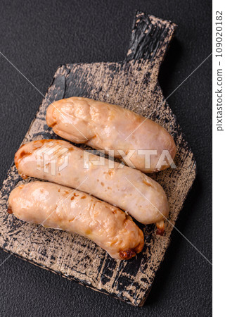 Delicious grilled chicken or pork sausages with salt, spices and herbs 109020182
