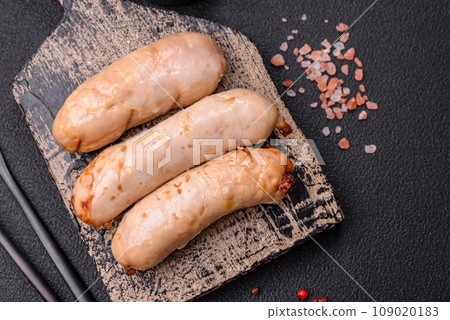 Delicious grilled chicken or pork sausages with salt, spices and herbs 109020183
