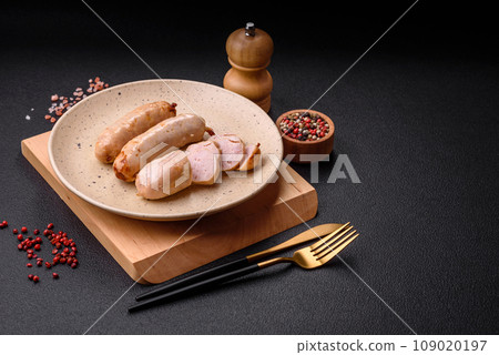 Delicious grilled chicken or pork sausages with salt, spices and herbs Delicious grilled chicken or pork sausages with salt, spices and herbs 109020197