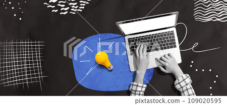 Person using a laptop computer and light bulbs Person using a laptop computer and light bulbs 109020595