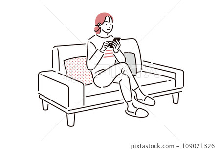 A woman sitting on a sofa and operating a smartphone A woman sitting on a sofa and operating a smartphone 109021326