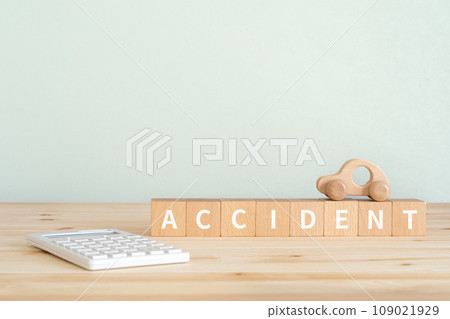 A block with the word ACCIDENT written on it, a calculator, and a car object. 109021929