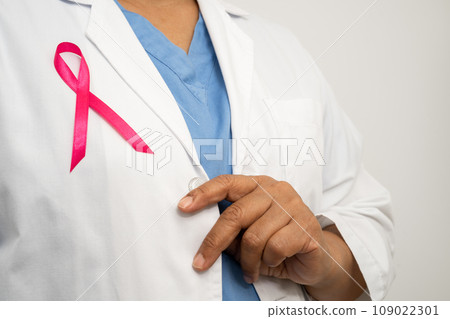 Breast cancer, Asian doctor woman with pink ribbon, symbol of World Breast Cancer Day. Breast cancer, Asian doctor woman with pink ribbon, symbol of World Breast Cancer Day. 109022301