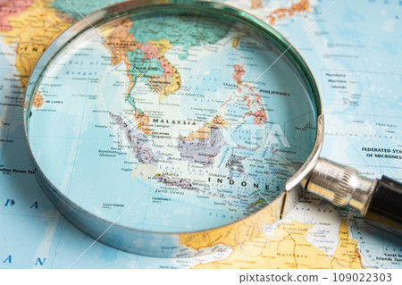 Bangkok, Thailand  January 20, 2022 Asia, Magnifying glass close up with colorful world map, travel, geography, tourism and exploration concept. 109022303