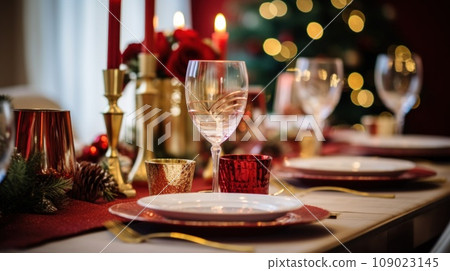 A festive Christmas table setting with red and gold accents 109023145