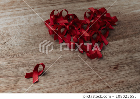 heart of red ribbons on a table 109023653