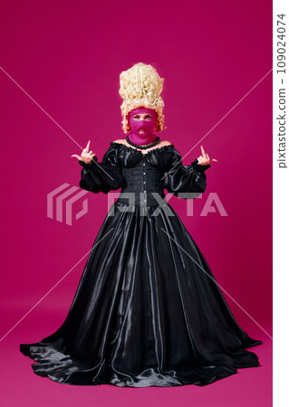 Portrait of queen, renaissance aristocratic person posing in mask shows obscene gestures against magenta background. 109024074