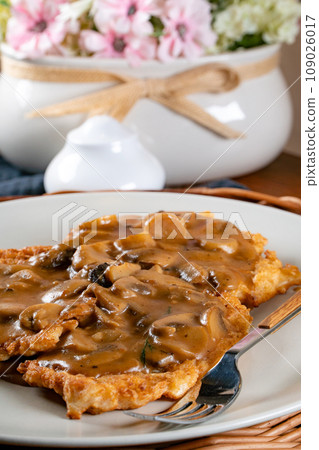 Sauerkraut pancakes /fuczka/ with mushroom sauce . Sauerkraut pancakes /fuczka/ with mushroom sauce . 109026017