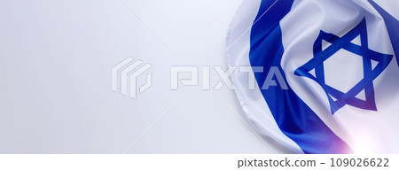 Banner with Official flag of Israel on a white background and empty space for text. Israeli flag for Jewish Holidays and independence day. Banner with Official flag of Israel on a white background and empty space for text. Israeli flag for Jewish Holidays and independence day. 109026622