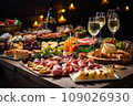 Light snacks in a plate on a buffet table. Assorted mini canapes, delicacies and snacks, restaurant food at event. A gala reception. Decorated delicious table for a party goodies. 109026930
