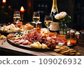 Light snacks in a plate on a buffet table. Assorted mini canapes, delicacies and snacks, restaurant food at event. A gala reception. Decorated delicious table for a party goodies. 109026932
