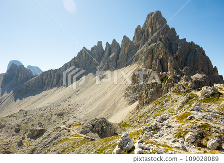 Rugged rocky peaks of Paterno mountain in Sexten Dolomite range 109028089
