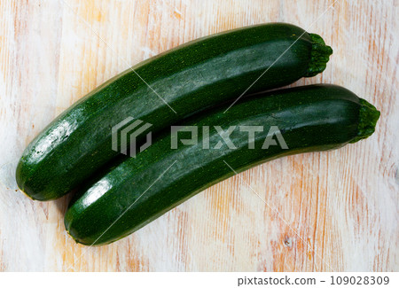 Zucchini on wooden table Zucchini on wooden table 109028309