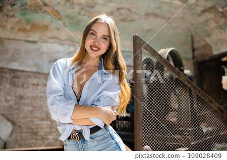 Portrait of attractive woman in abandoned building Portrait of attractive woman in abandoned building 109028409