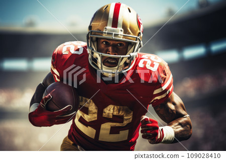American football player of African descent in a red uniform with the ball 109028410