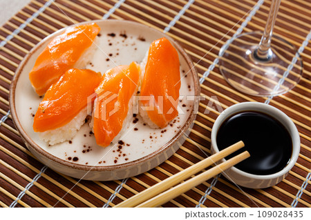 Sushi sake nigiri with salmon served on platter 109028435