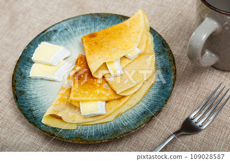 Crepes served in a plate with brie cheese Crepes served in a plate with brie cheese 109028587