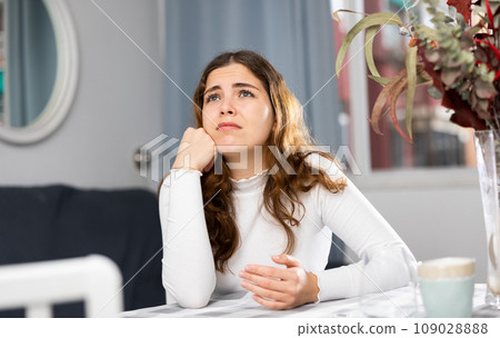 Portrait of stressed young woman at home Portrait of stressed young woman at home 109028888