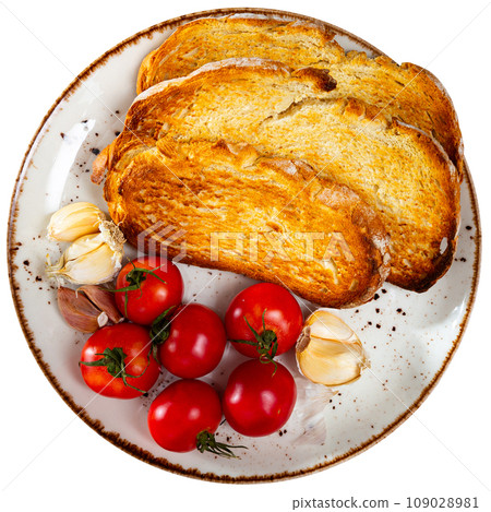Crispy toasted white bread slices, fresh tomatoes and garlic served on plates. Ingredients for traditional Catalan tapas Pan con tomate Crispy toasted white bread slices, fresh tomatoes and garlic served on plates. Ingredients for traditional Catalan tapas Pan con tomate 109028981